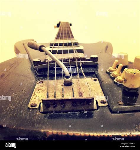 Old rusty dusty guitar Stock Photo - Alamy