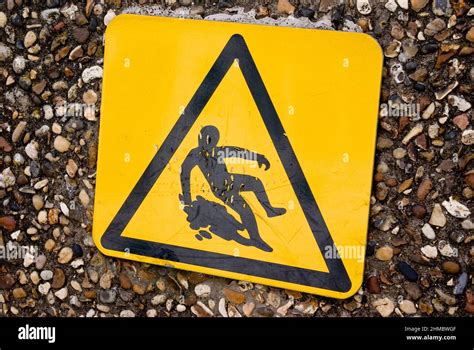 Slippery surface warning sign Stock Photo - Alamy