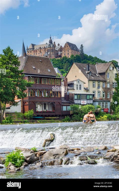 Marburg: river Lahn, bather at ground sill, houses, castle Marburger ...