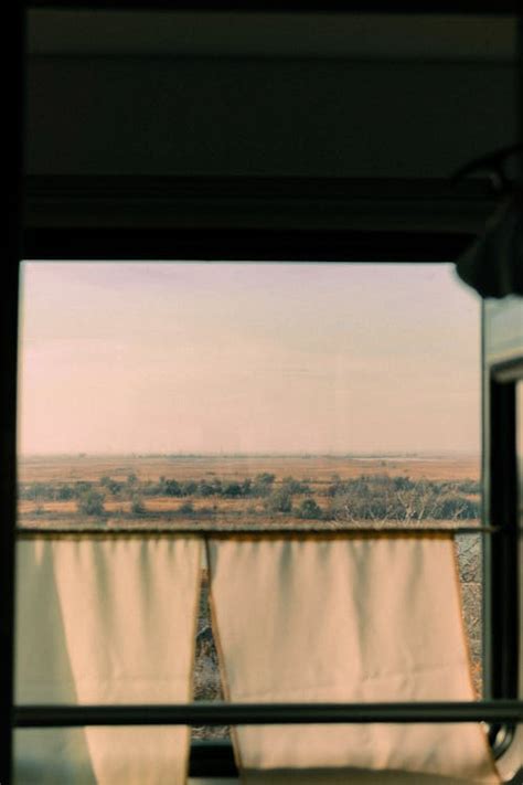 Countryside behind Train Window · Free Stock Photo