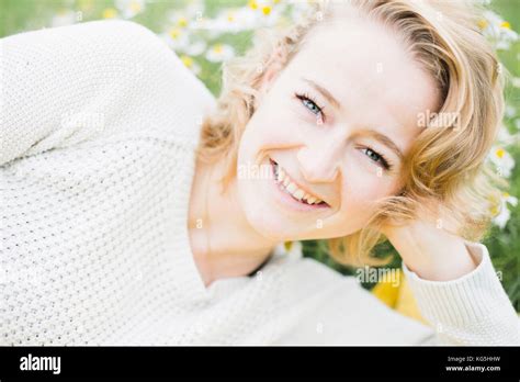 young woman smiling in nature Stock Photo - Alamy