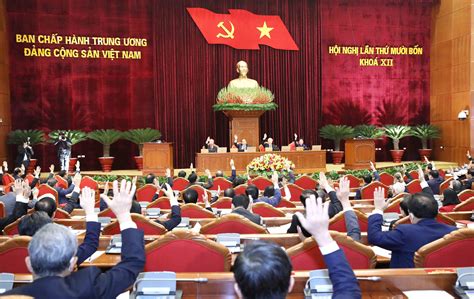 Members of the Party Central Committee of the CPV voting to approve the working program of the ...