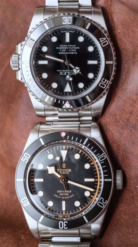 Rolex Submariner 114060 'No Date' Vs. Tudor Heritage Black Bay Black ...