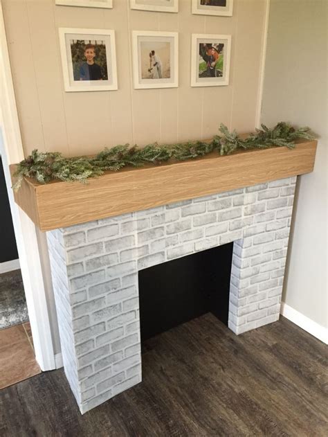 Cardboard fireplace with mantle decor | Diy christmas fireplace, Faux fireplace diy cardboard ...