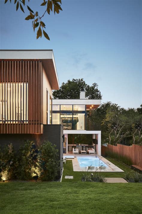 SLIC Design Creates a Modern Glass House That Rises to the Treetops