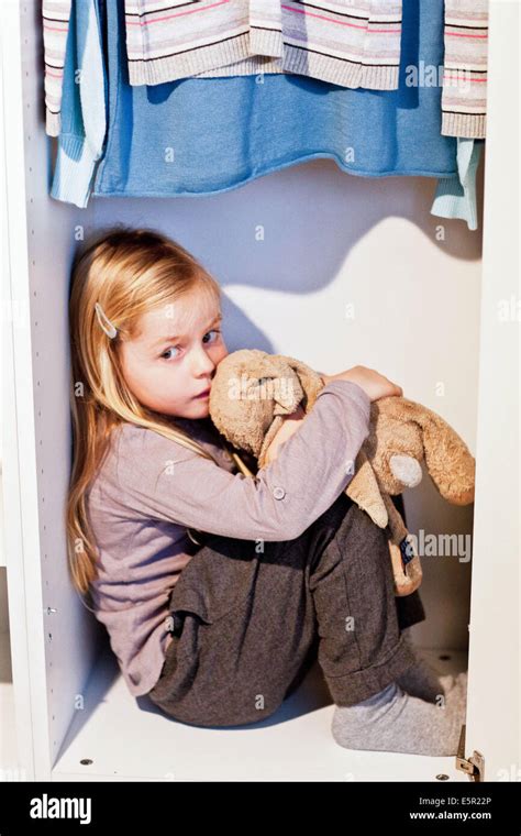 5 year old girl in a closet Stock Photo - Alamy