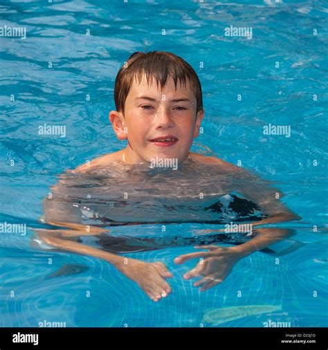 A 12 year old boy swimming in a swimming pool Stock Photo - Alamy