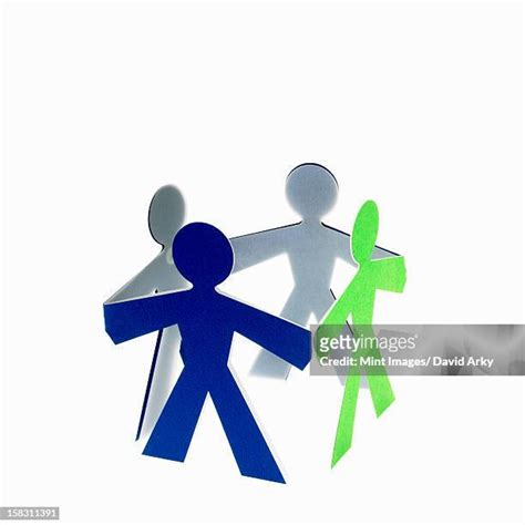 72 Paper Cut Out People Holding Hands Stock Photos, High-Res Pictures ...