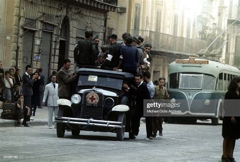 A view as Allied forces drive through town 5 days after winning the ...