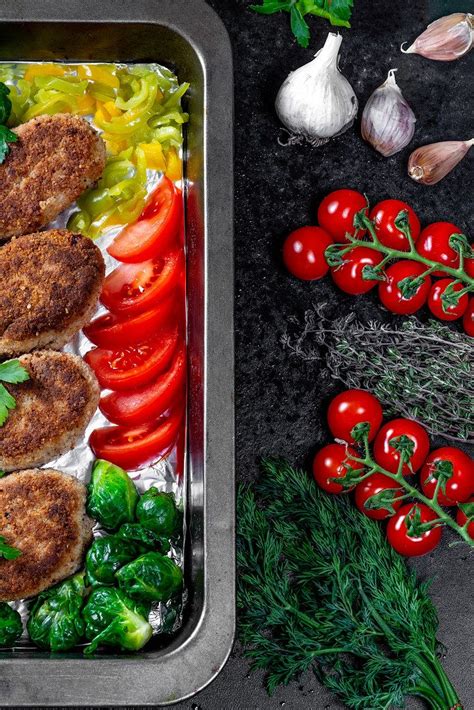 Juicy delicious meat cutlets with vegetables on a dark table in a rustic style - Creative ...