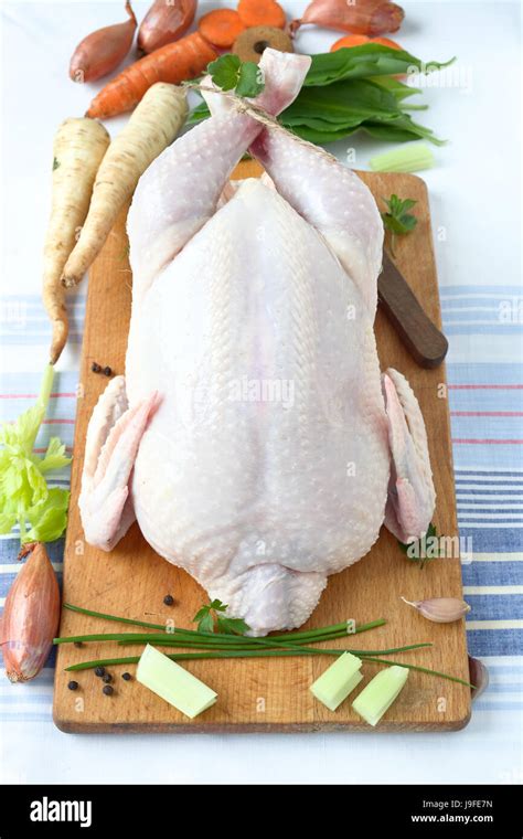 Whole raw chicken Stock Photo - Alamy