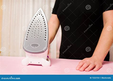 Ironing Clothes with Steam Iron Stock Photo - Image of clothes ...