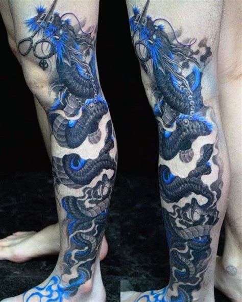 two men with tattoos on their legs and one is wearing blue dragon tattoo inks