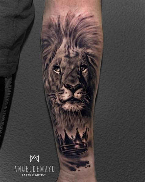 Lion portrait tattoo on the inner forearm