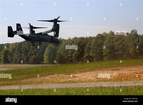 A U.S. Marine Corps MV-22B Osprey lands at a landing zone to transport ...