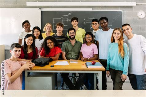 Large group portrait of millennial diverse students with male teacher ...