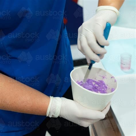 Image of Mixing dental alginate to take teeth impressions - Austockphoto