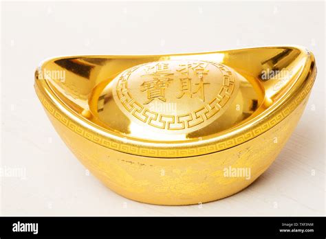 Chinese gold ingot Stock Photo - Alamy