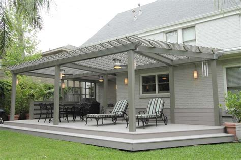 This deck offers a pergola, clear plastic roofing and lighting with ...