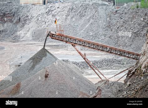 conveyor belt in an open pit mine of porphyry rock Stock Photo ...