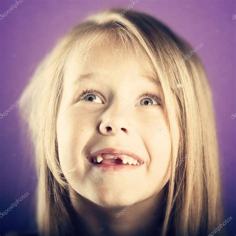 Little girl with missing teeth — Stock Photo © nanka-photo #71438061