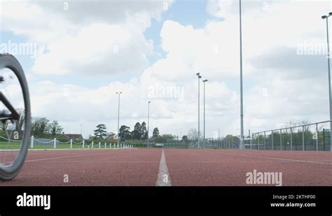 4K Disabled wheelchair athletes training together at race track Stock ...