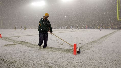 Lambeau Field is covered in snow, forecast for snow showers during ...