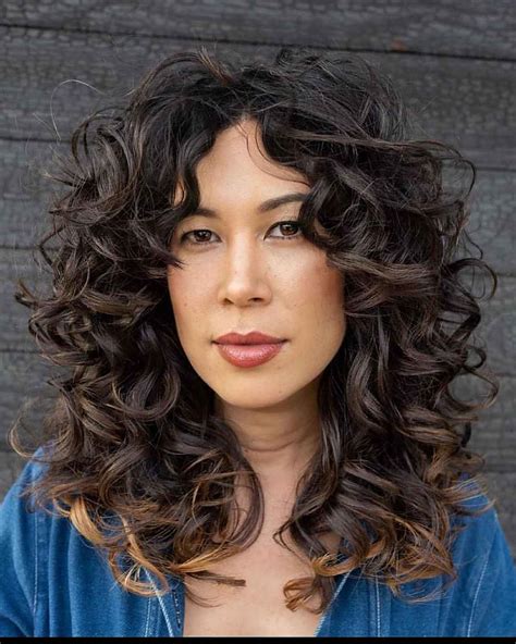 21 Best Ways To Get Curtain Bangs For Curly Hair Right Now