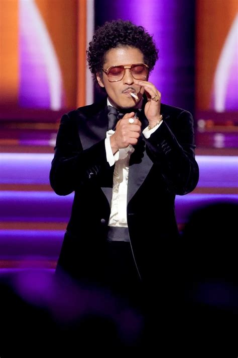 Watch Bruno Mars Light a Cigarette While Accepting a 2022 Grammy