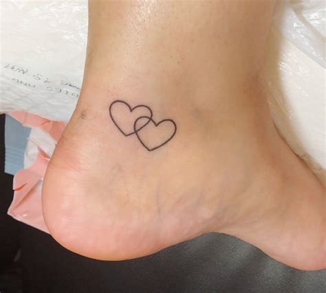 Two hearts tattoo #heart #hearttattoo #tinytattoo #smalltat #ankletattoo #tattoo # ...