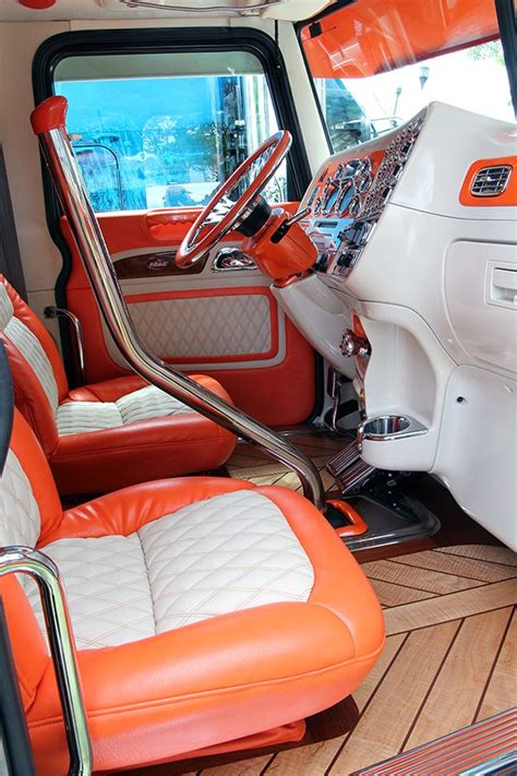 an orange and white truck interior with leather seats