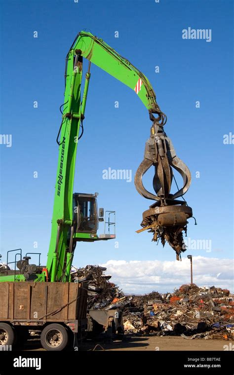 Electromagnetic crane lifting scrap steel for recycling at the Pacific Steel and Recycling ...