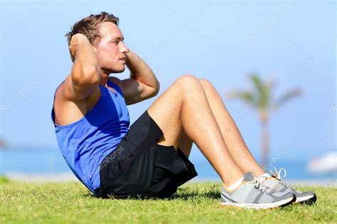 Sit-ups - fitness man training sit up outside — Stock Photo © Maridav ...