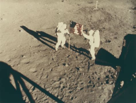 THE ASTRONAUTS PLANTING THE AMERICAN FLAG ON THE LUNAR SURFACE, JULY 16 ...