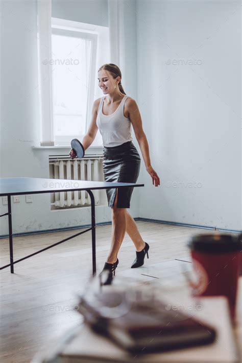 Lunch break activities concept. Office games during Lunch break. Attractive young Business woman ...