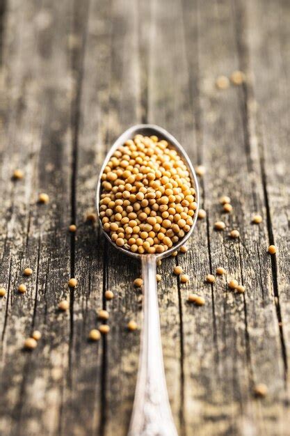 Premium Photo | Yellow mustard seeds