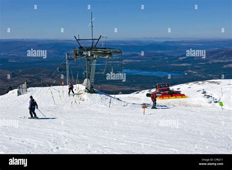 Skier arriving at the top station on the Cairngorm Mountain ski resort ...