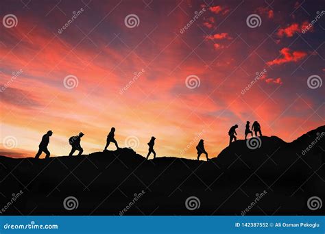 Eight Friends Walk on Mountain Path in Sunset Stock Photo - Image of ...