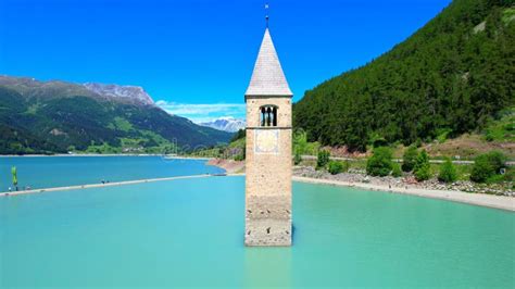 Church Tower in Lake Reschen - South Tyrol - Italy - 4k Drone Photo Stock Image - Image of ...