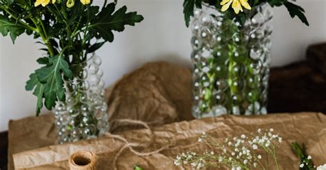 Pruner and twine rolls on table with flower bouquets · Free Stock Photo