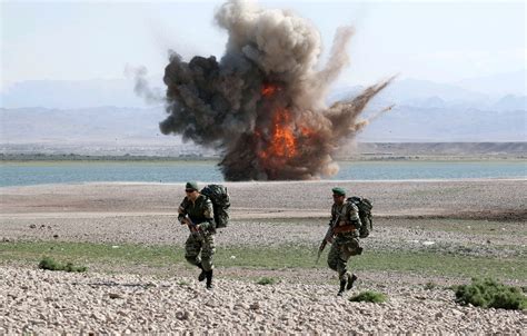 Iran holds border war games amid tense relations with Azerbaijan | Reuters