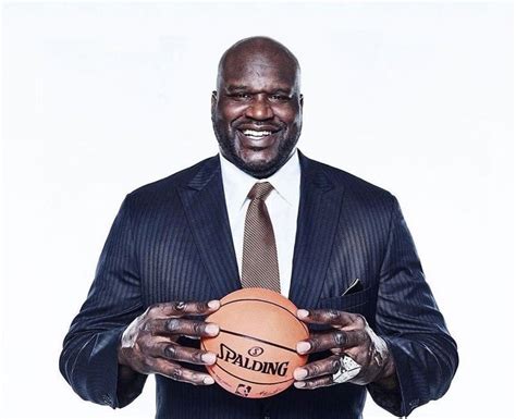 5 pictures of Shaq holding things from daily life and making them look tiny