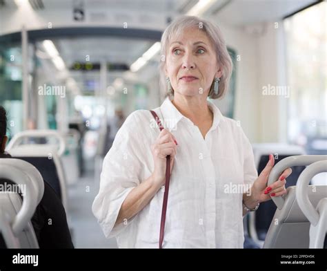 Mature lady in bus Stock Photo - Alamy