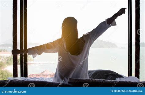 A Woman Wake Up with Sunrise in the Morning Stock Photo - Image of indoor, comfort: 166867276