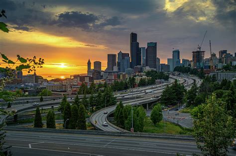 Dramatic sunset over Seattle downtown skyline Photograph by Miroslav ...