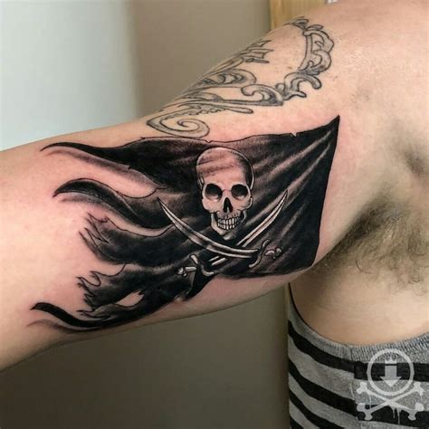 Rad Jolly Roger flag tattoo by Chris Curtis. #12ozstudios #team12oz #tattoo #tattoos #tattooed # ...