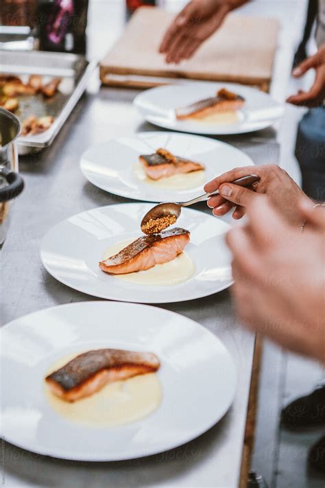 "Preparing Salmon With Caviar Plates." by Stocksy Contributor "Kazim ...