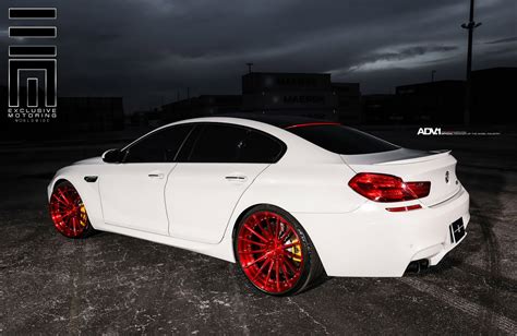 White BMW M6 Gran Coupe Dares To Put On Gloss Red Wheels | Carscoops