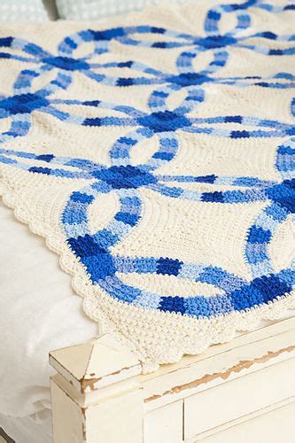 A traditional double wedding ring quilt pattern, reinterpreted in crochet, makes an afghan ...