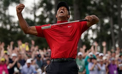 Seeing double: Tiger Woods and son Charlie tee off in perfect symmetry ...